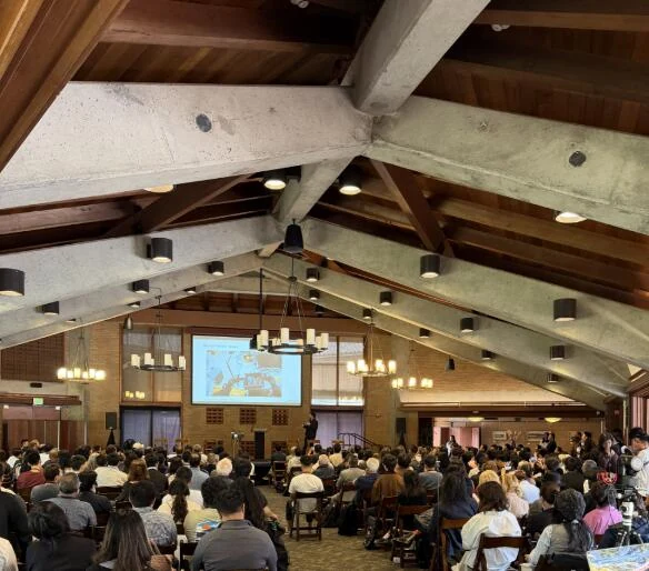 Audience gathered for a presentation at Stanford