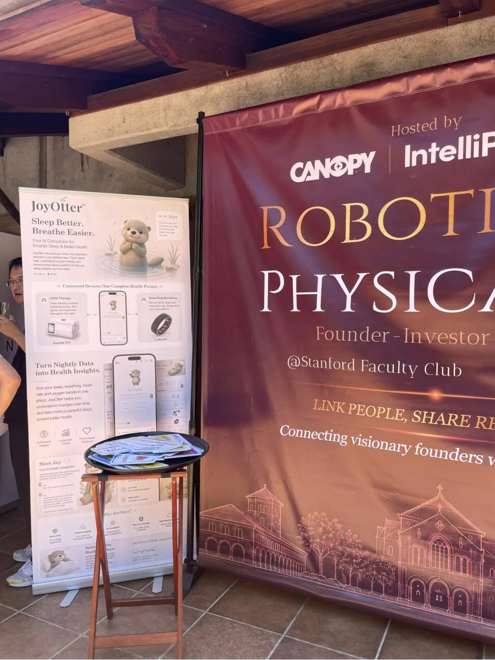 JoyOtter exhibit beside the Robotics and Physical AI event backdrop