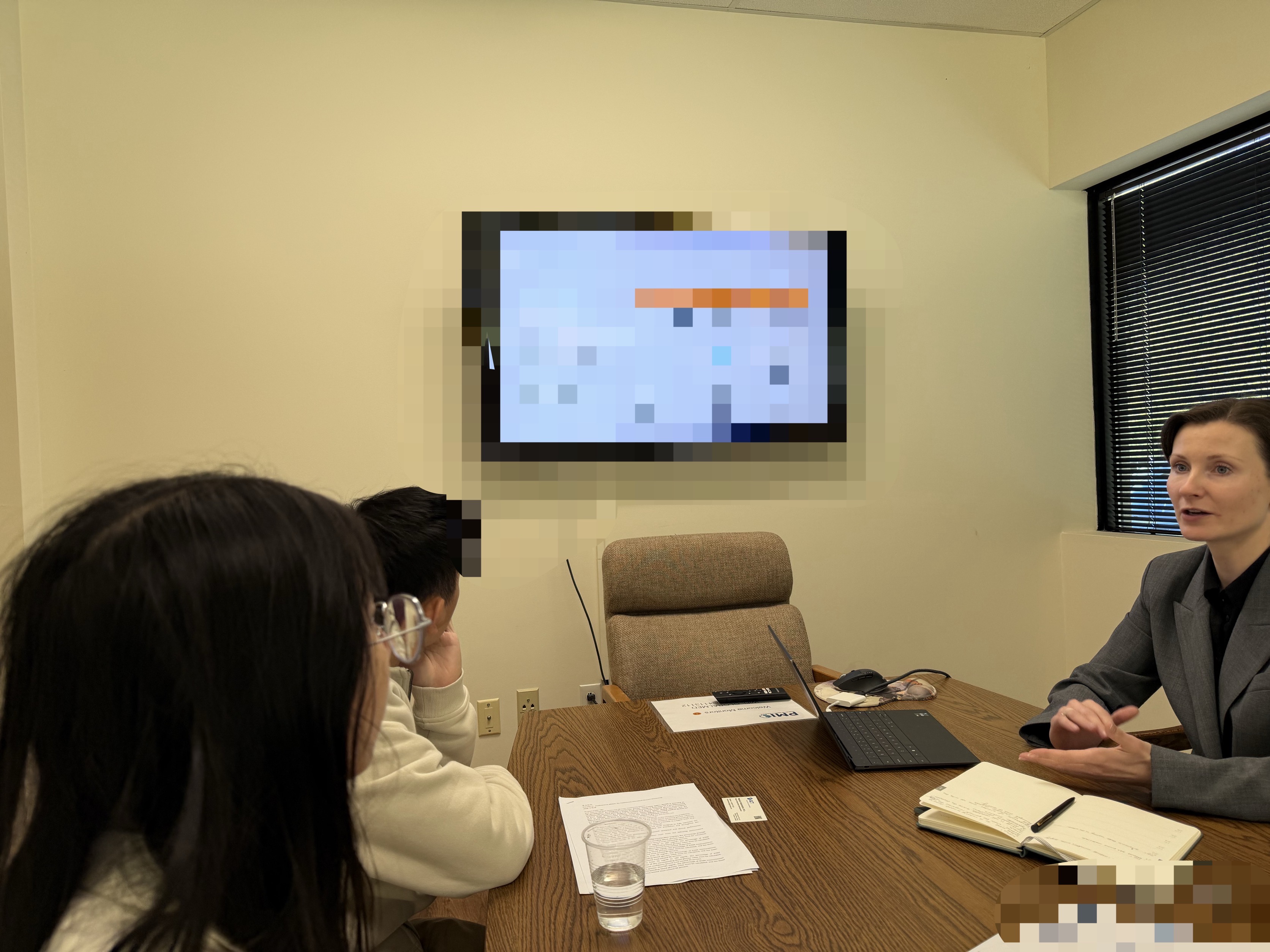 In-person discussion around a meeting table