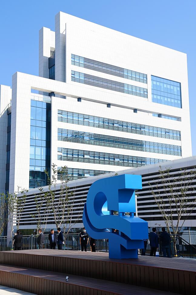 Modern building exterior with a blue sculpture